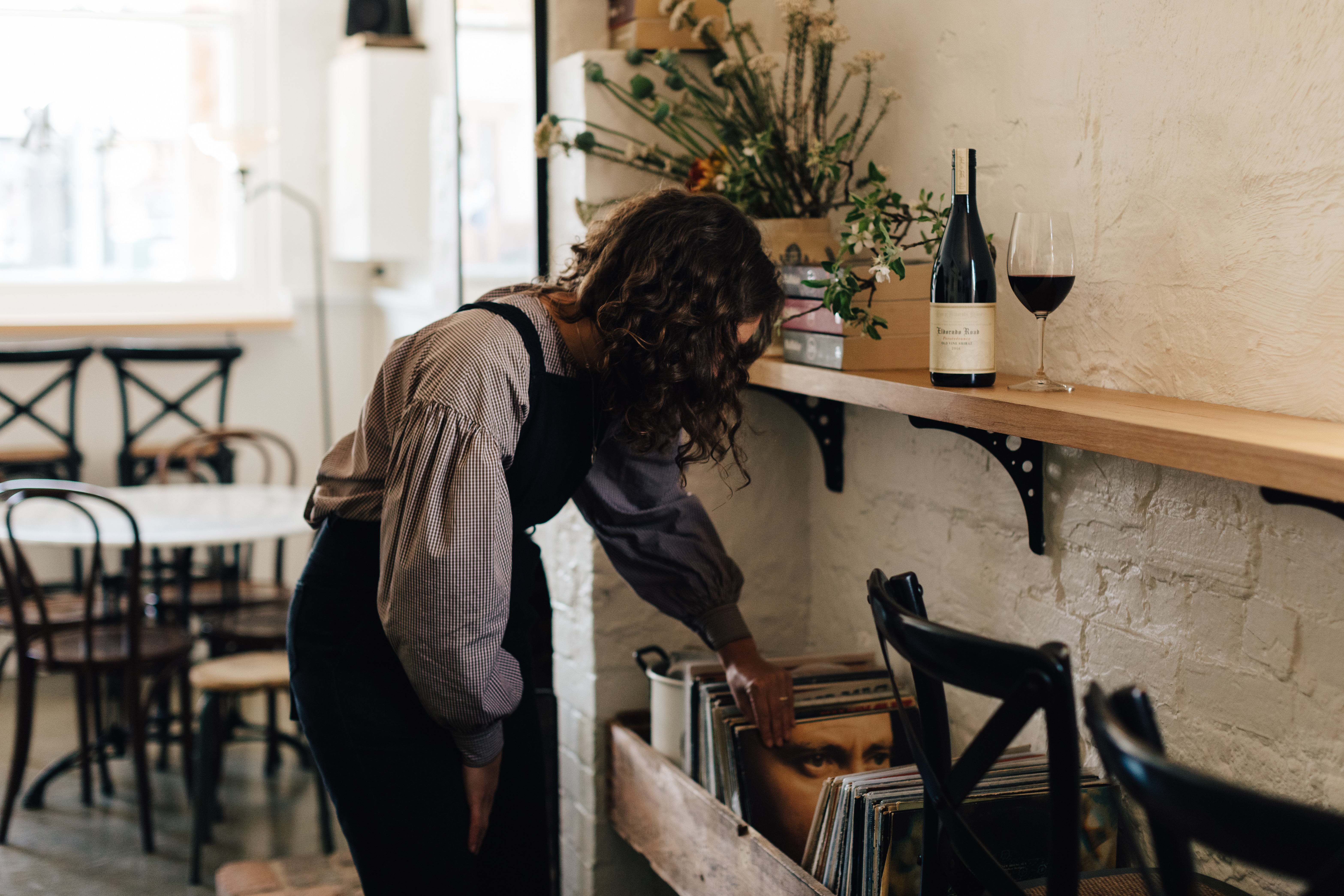 A woman inside Eldorado Road cellar door 